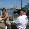 Driving a boat in the flooded streets of post Katrina New Orleans.